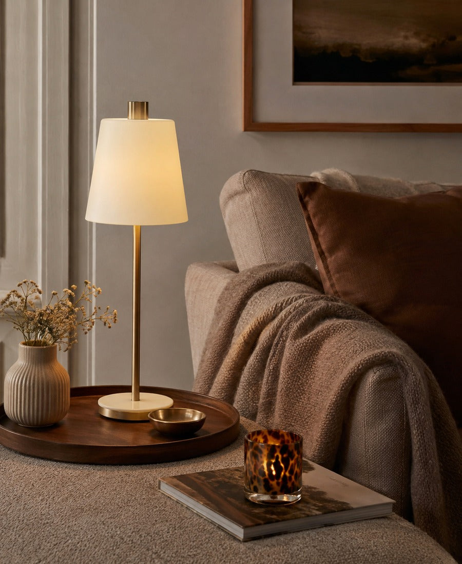 Warm lamp and home accents in an editorial interior